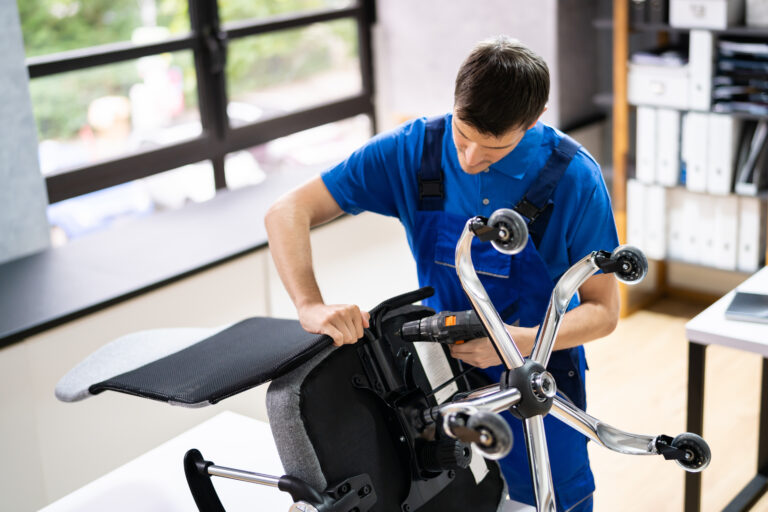 Office Chair Assembling And Repair. Man Working With Tool